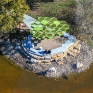 Bowl Lake Pavilion Green, honeycombed screened roof above a circular spot to sit or stand next to the water